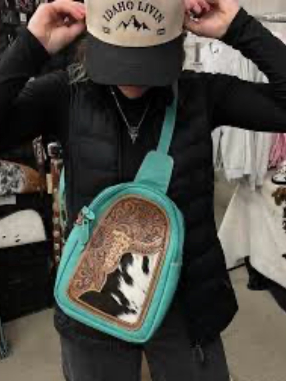 Myra Estancia cowhide tooled leather sling bag